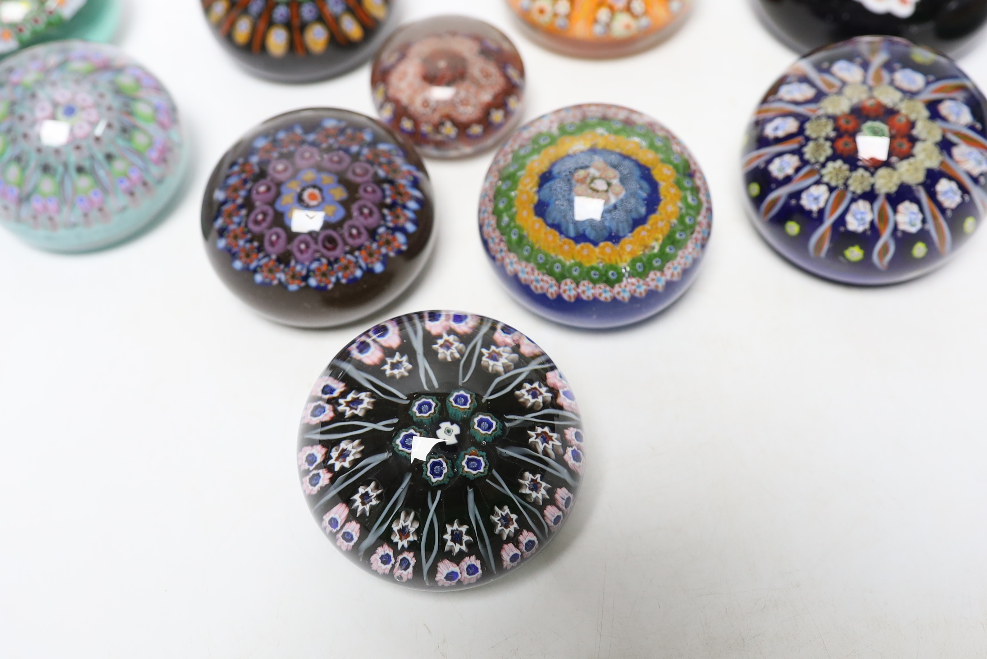 Twelve various mixed glass paperweights